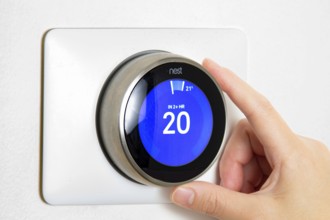 Calgary, Alberta, Canada. Jun 5, 2020. A person cooling down Home Air Conditioning, temperature is