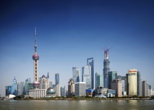 Pudong riverside modern urban skyline skyscrapers in central shanghai city china by day