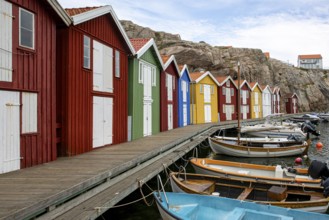 Small colourful houses by the sea. Typical houses in Sweden for the coastal landscape. Crab fishing