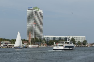 View from the Priwall onto the river Trave with the excursion ship Hansa and the Hotel Maritim,