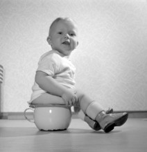 In the 1950s. A toddler boy is pictured sitting on the potty. Sweden 1956. Conard ref 3158