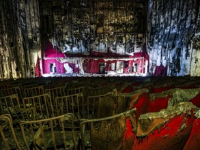 Abandoned and burned cinema hall in an old multiplex cinema