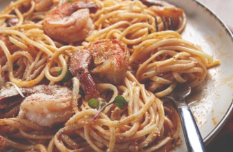 Spaghetti with tiger prawns, in tomato sauce, homemade, top view, no people