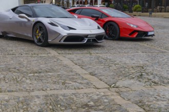 Ronda, malaga, spain 11-27-2024 two beautiful Ferraris parked on a cobblestone street with copy