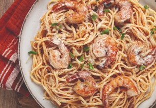 Spaghetti with tiger prawns, in tomato sauce, homemade, top view, no people