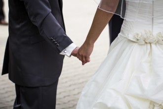 Couple holding hands