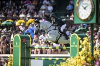 Hilary Scott of Australia and riding Oaks Milky Way compete in the first round of the 1.60m CPKC