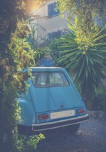 European Travel Image Of A Vintage Car Outside A French Chateau Or Holiday Home In The Evening