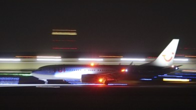 TuiFly Boeing 737 landing at night at Stuttgart Airport