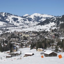 Ski slope and view of Gstaad in winter