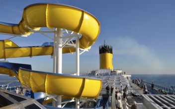 On deck of the cruise ship Costa Serena, deck chairs, sun deck, ship's funnel
