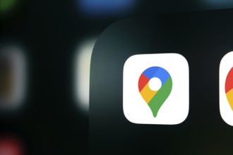 A close up of an iPhone screen displaying the Google maps logo