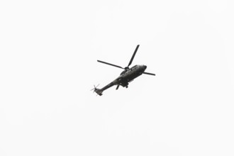 Photo of Military navy helicopter flying isolated on white background