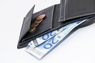 Black leather wallet against a white background