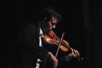 Violinists performing in live concert