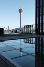 View of the Rhine Tower in the Media Harbour, reflection, Düsseldorf, Germany, Europe