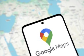Google maps logo is displayed on smartphone