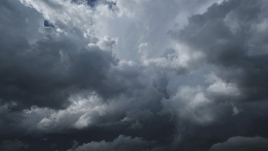 Dramatic dark storm clouds in sky background