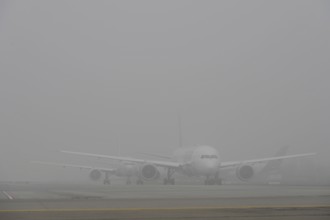 Taxiing aeroplanes in the fog, traffic, Apron 2 East, Terminal 2, Munich Airport, Upper Bavaria,