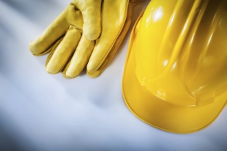 Safety gloves hard hat on white background
