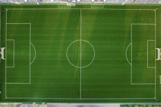 Aerial photographic documentation of an empty green football pitch