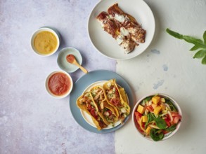 Mexican tacos with sauces and salad flat lay