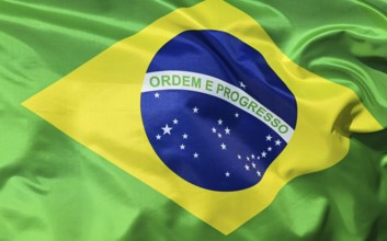 Close-up of the Brazilian national flag fluttering in the wind with folds and wave patterns