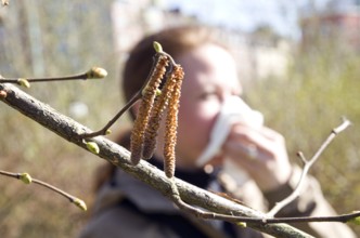 A woman suffer from tree pollen. A woman suffers from tree pollen