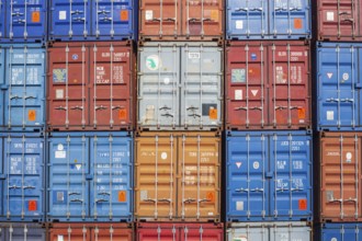 Stacked colourful freight containers at the container terminal in Holz-und Fabrikenhafen, Bremen,