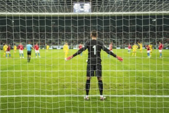 Net in the football goal penalty shootout in the background.