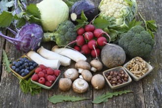 Healthy food, berries, cabbage, radishes, king oyster mushrooms, raspberries, nuts, blueberries,