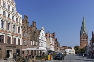 Historic surrounding gabled houses with many shops and restaurants on the square Am Sande in the