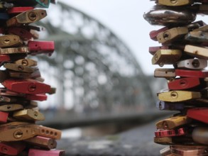 Love locks on a bridge over the Rhine, blurred background, Cologne, Germany, Europe