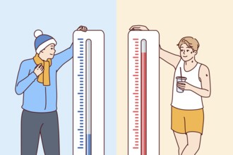 Man stands near thermometers showing different temperatures and feels heat or cold in different
