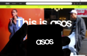 Dhaka, Bangladesh 14 Dec 2024:Cellphone with logo of British fashion retail company ASOS plc on