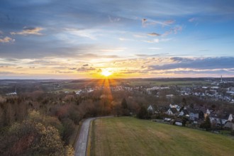 Sunset, Aerial view over forests and meadows of Westerwald, Altenkirchen, Germany, Europe