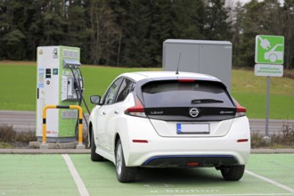 Salo, Finland, November 23, 2018: Nissan Leaf electric car charging battery at Fortum Charge &