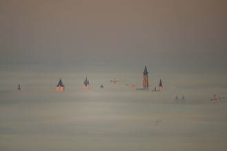 The towers of the town of Straubing (Lower Bavaria) in the morning mist