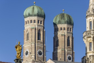 Towers of the Church of Our Lady and the golden statue of the Marian Column on Marienplatz, Munich,