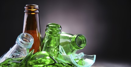 Broken glass bottles and pieces of glass. Recycling