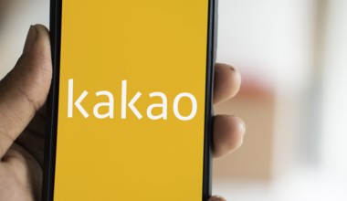 Kakao logo is displayed on smartphone.