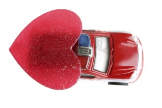 Red police car in Valentines day, good heart metaphor