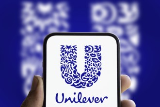 unilever logo is displayed on smartphone. Unilever PLC is a British multinational fast-moving
