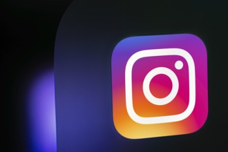 A close up of an iPad screen displaying the instagram app icon