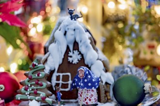 Hansel and Gretel gingerbread house with Christmas decorations and bokeh