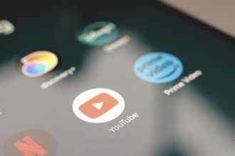 In this photo illustration, the app logo Netflix, YouTube and Prime Video is displayed on a