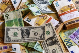 Banknotes, euro, US dollar, Norwegian krone and Swedish krona. Piles and bundles