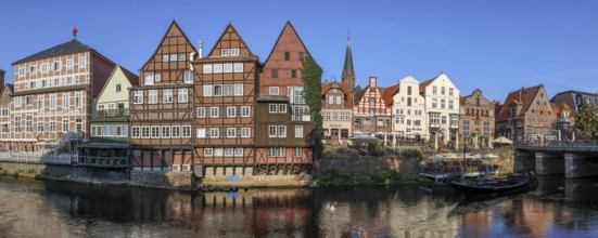 Panoramic photo Lüneburg harbour at the Illmenau with old Hanseatic wooden boats, surrounding