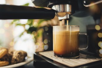 Cup of coffee at the coffee maker, coffee time.