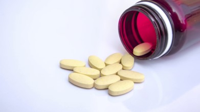 Open Medicine Bottle with Scattered Pills, Pharmaceutical Healthcare Background, Close-up, Medical